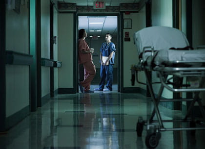 Hospital doctors in corridor at night